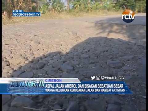 Aspal Jalan Ambrol Dan Sisakan Bebatuan Besar