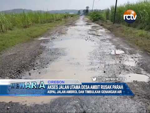 Akses Jalan Utama Desa Ambit Rusak Parah