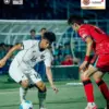 Timnas Indonesia saat bertanding dengan Timnas Korea Selatan